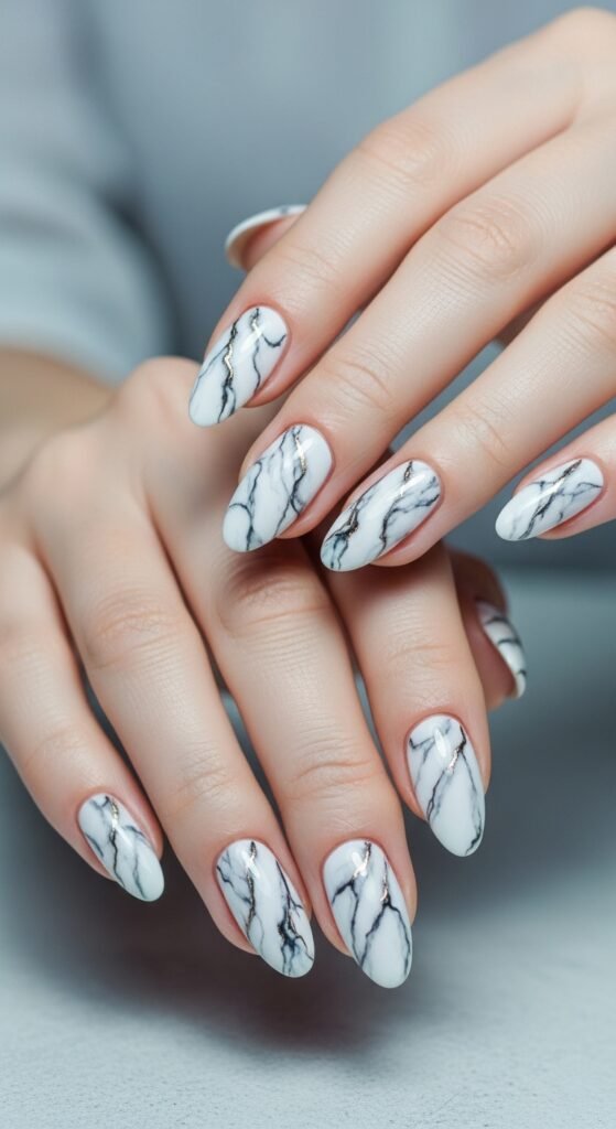 A stunning beauty editorial featuring beautifully manicured hands showcasing multiple cool nail art designs including chrome effects, pressed flowers, geometric patterns, and glitter ombre on a white marble surface, illustrating 15 cool nails ideas as a complete guide to achieving stunning and creative manicures.