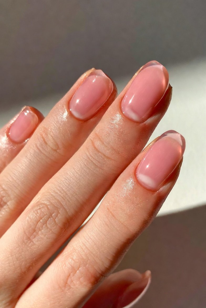 A beautifully curated collection of 17 stunning gel nail ideas applied on natural nails showcasing long-lasting and confidence-boosting manicure designs from sheer pink glass finish and rosewater jelly florals to dusty lavender velvet matte champagne gold chrome black cherry microglitter and pearlescent reverse French tips for effortlessly elevated everyday nail beauty.