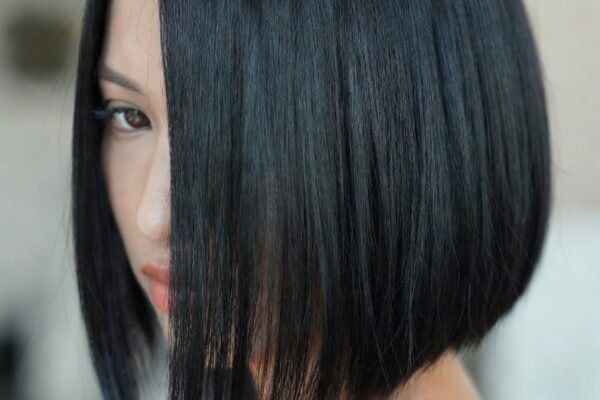A beautifully curated collection of 20 effortless and stylish low maintenance haircut ideas showcasing a confident woman with a perfectly executed blunt bob representing the full range of time-saving and morning-stress-free hairstyles from classic pixie cuts and French bobs to textured shags wavy mullets butterfly cuts and cropped French crops for every hair type and lifestyle.