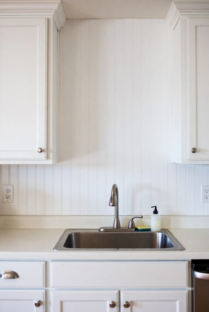18. Bead Board Backsplash with Distressed Paint Finish