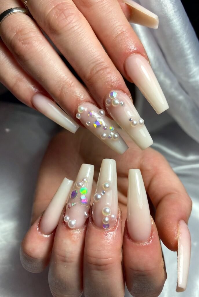 3. Milky White Coffin Nails with Pearl Embellishments