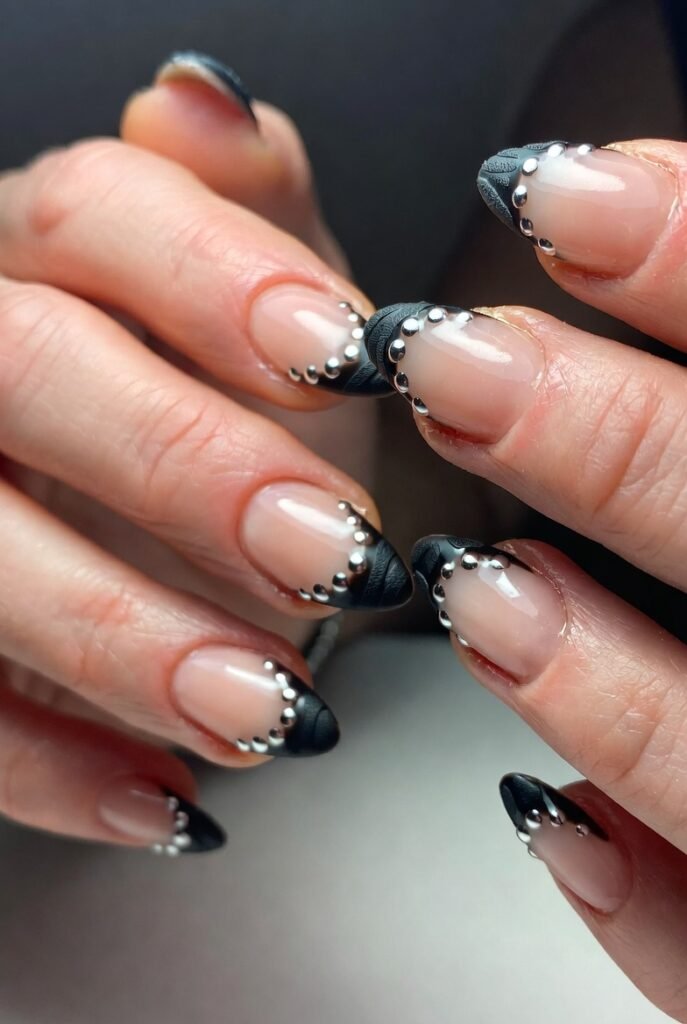 Black Leather-Textured Tips with Silver Studs Along the Smile Line