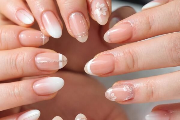 Close-up of beautifully styled short nails showcasing a stunning variety of chic and wearable nail art designs including minimalist patterns, delicate florals, pastel gradients, geometric accents, and elegant French tips, perfect inspiration for creative and flattering short nail art ideas that celebrate natural nail length