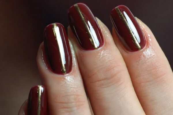 A breathtakingly bold and romantic collection of 18 striking dark red nail inspiration designs showcasing beautifully manicured hands featuring the most alluring and wearable dark red manicure ideas from deep glossy crimson and matte burgundy velvet to dark cherry shimmer glitter accents metallic foil details and minimalist negative space art for the ultimate statement manicure that unleashes your most confident and romantically bold side.