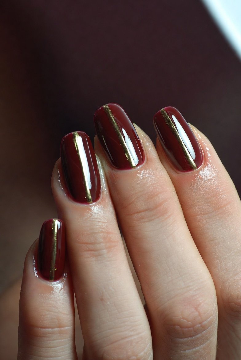 A breathtakingly bold and romantic collection of 18 striking dark red nail inspiration designs showcasing beautifully manicured hands featuring the most alluring and wearable dark red manicure ideas from deep glossy crimson and matte burgundy velvet to dark cherry shimmer glitter accents metallic foil details and minimalist negative space art for the ultimate statement manicure that unleashes your most confident and romantically bold side.