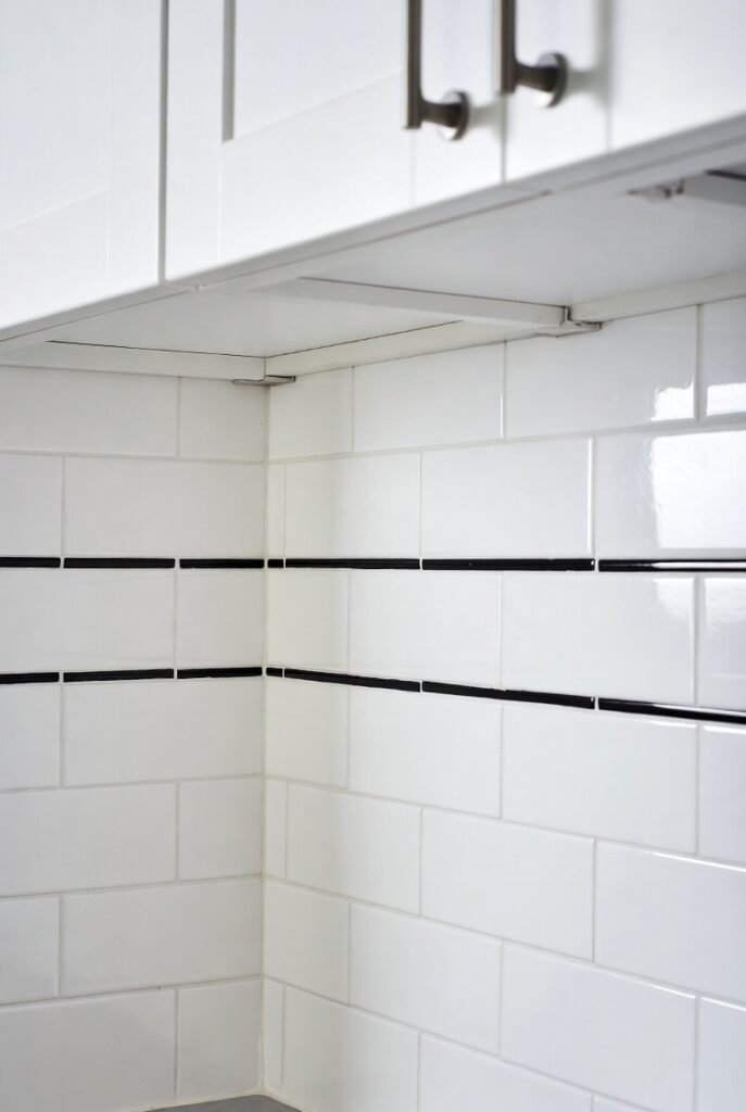4. White Subway Tile with Black Grout
