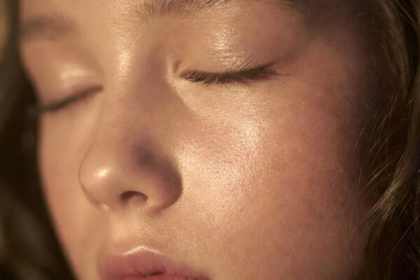 Natural prom makeup look featuring glowing skin, soft blush, neutral eyeshadow, and fluttery lashes for effortless, radiant prom beauty inspiration.
